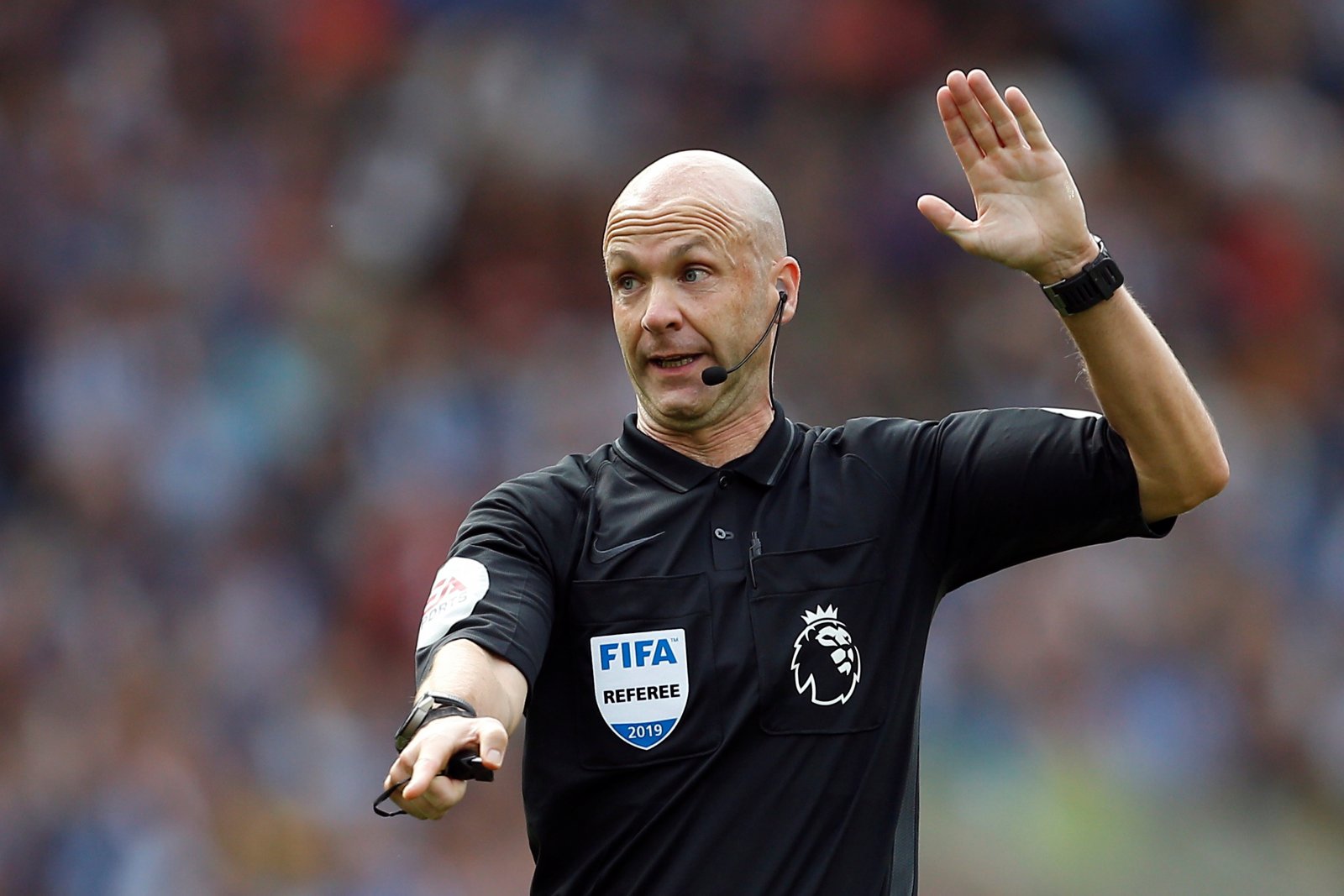 referee anthony taylor gestures v brighton after disallowing a leandro trossard goal after a var review august 2019