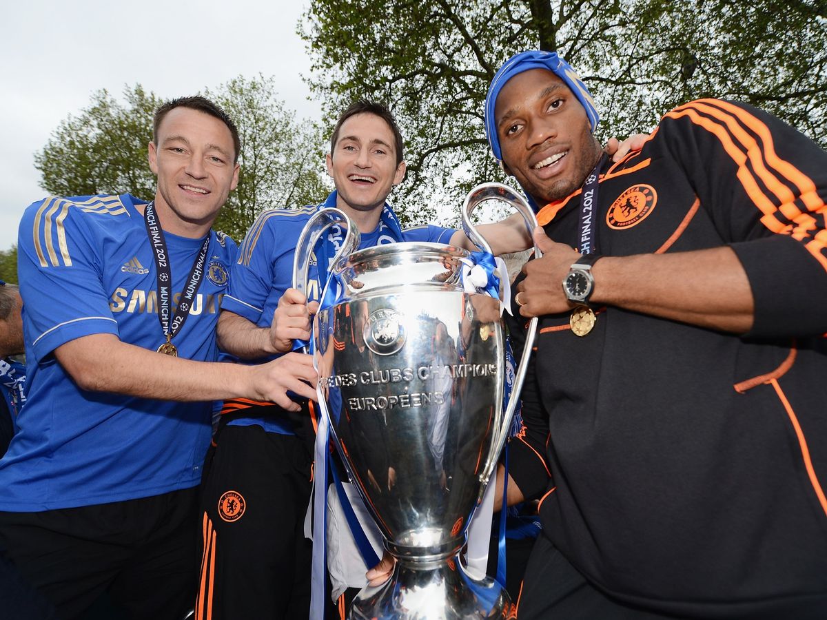 John Terry Frank Lampard and Didier Drogba pose with the Champions League trophy