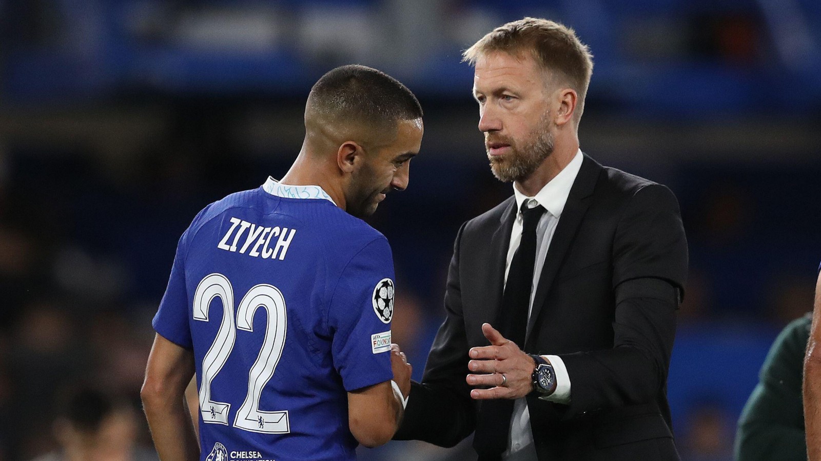 Chelsea forward Hakim Ziyech is embraced by manager Graham Potter