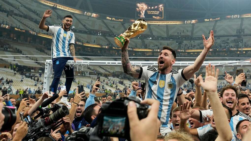 lionel messi celebrates with the trophy 1 6200058 1671398409091