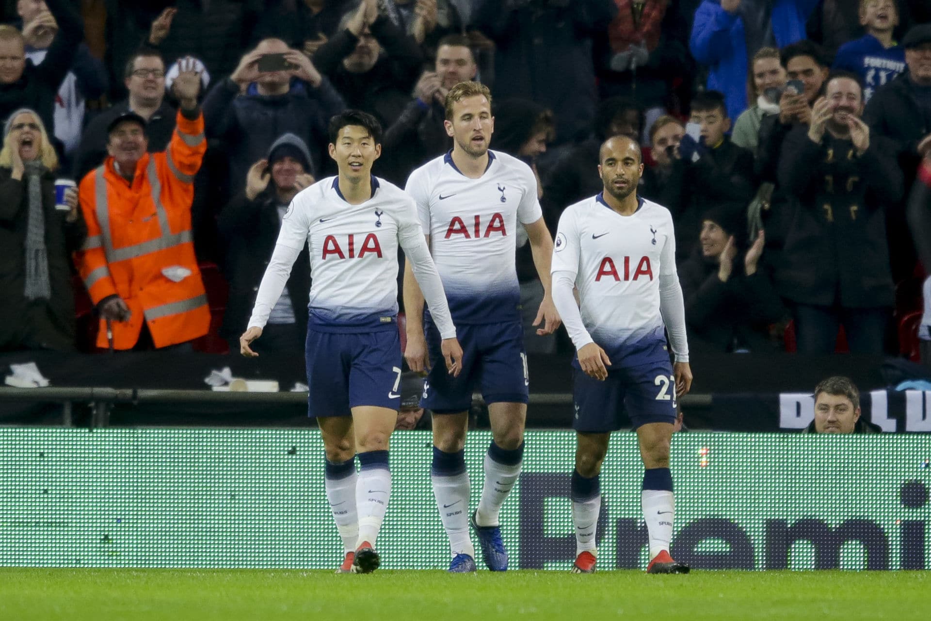 harry kane is congratulated by teammates heungmin son and lucas 1175139